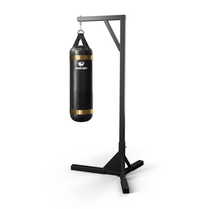 PROLAST 4 ft 80 lb stock heavy bag, black with gold trims, hanging from a PROLAST single bag stand on a steel snap hook through its D-rings (stand sold separately)