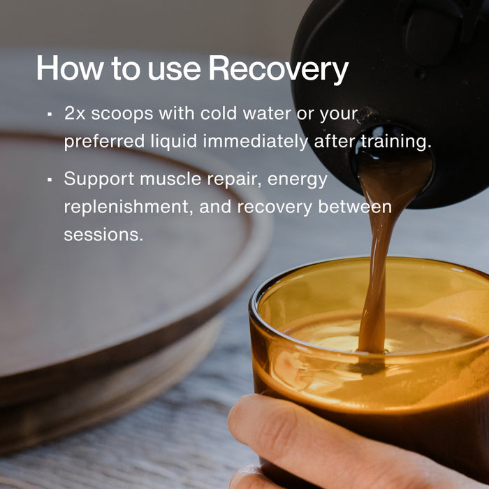 Close-up of chocolate recovery drink being poured into a glass. Overlaid text reads: “How to use Recovery: 2x scoops with cold water or your preferred liquid immediately after training. Support muscle repair, energy replenishment, and recovery between sessions.”