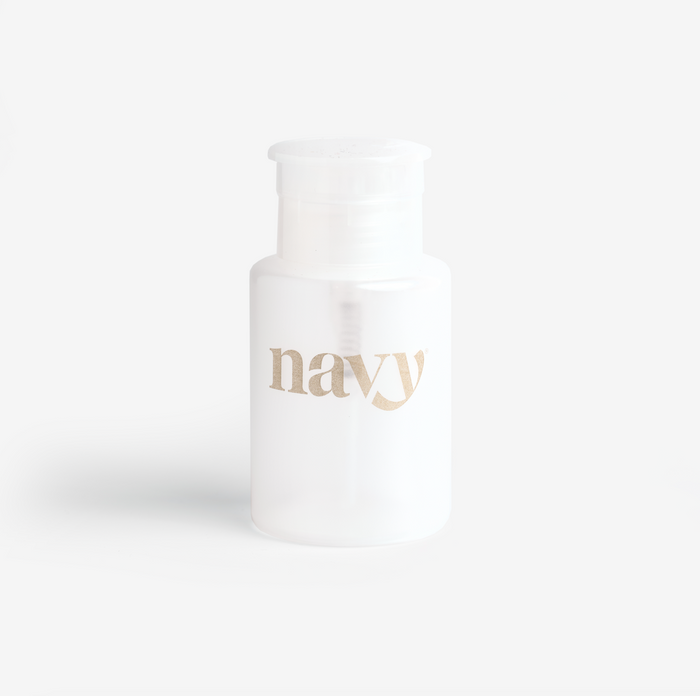 A white refillable pump bottle with the brand name 'navy' printed on it against a light background.