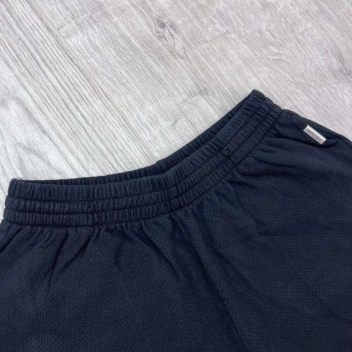 Front view of the elasticated waistband Represent Owners Club Mesh Shorts in Black.
