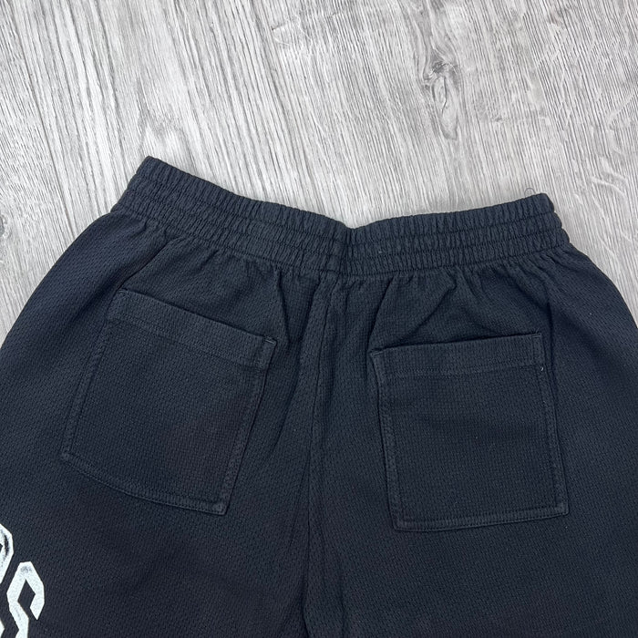 A rear view of Represent Owners Club Mesh Shorts in Black showing the pockets.