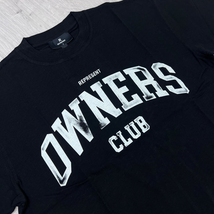 A close up view of the screen printed logo on the Represent Owners Club T-Shirt in Jet Black.