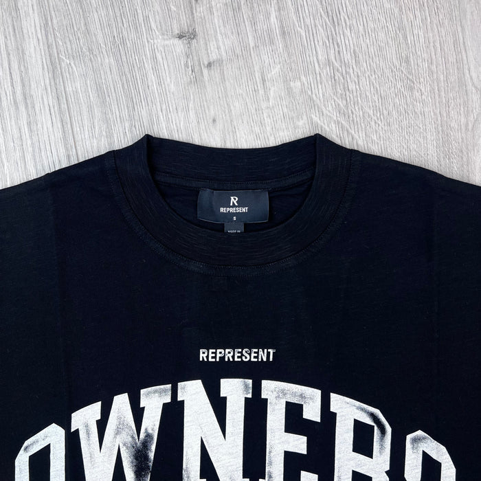 A close up view of the crewneck collar and neck label on the Represent Owners Club T-Shirt in Jet Black.