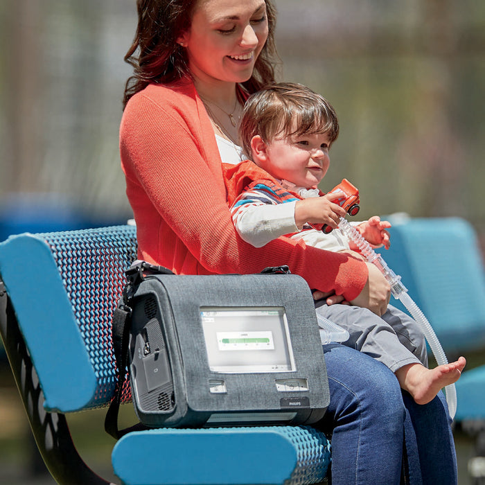 Woman and Child on Bench with Trilogy Evo