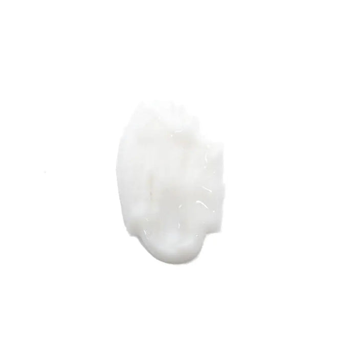 A dollop of thick, glossy white cream or lotion on a solid white background.