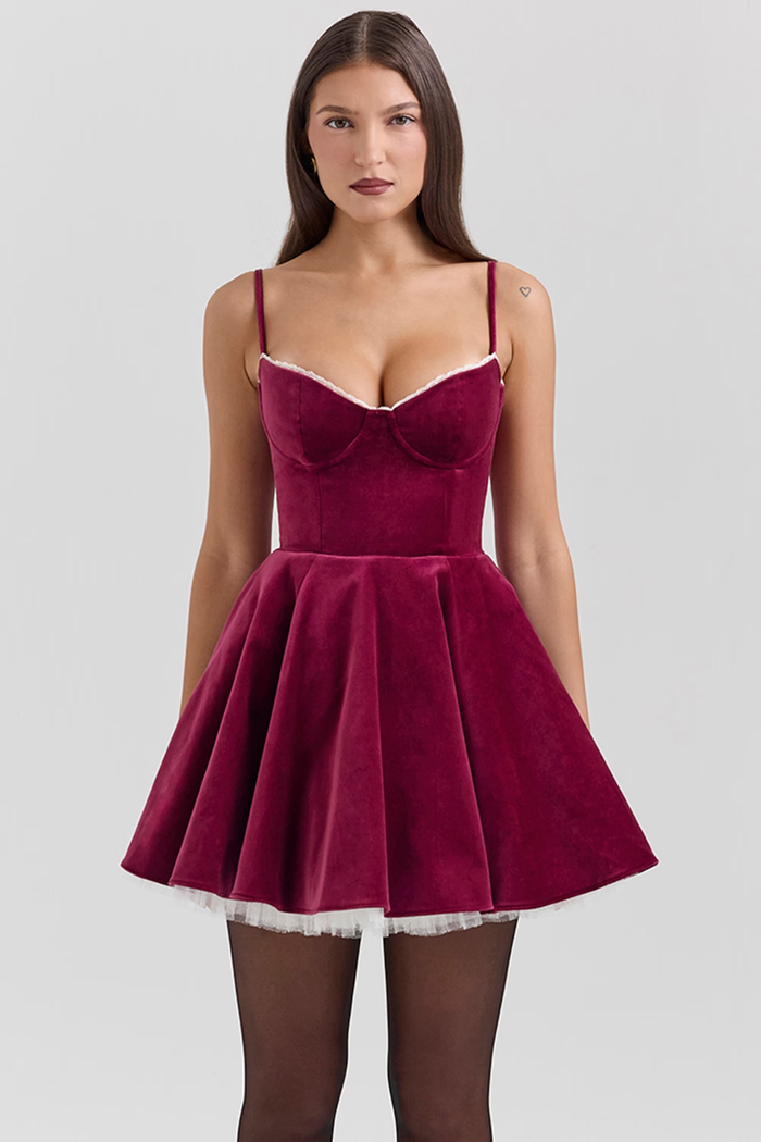 Ruby velvet mini dress with corseted bodice and tulle underskirt in burgundy