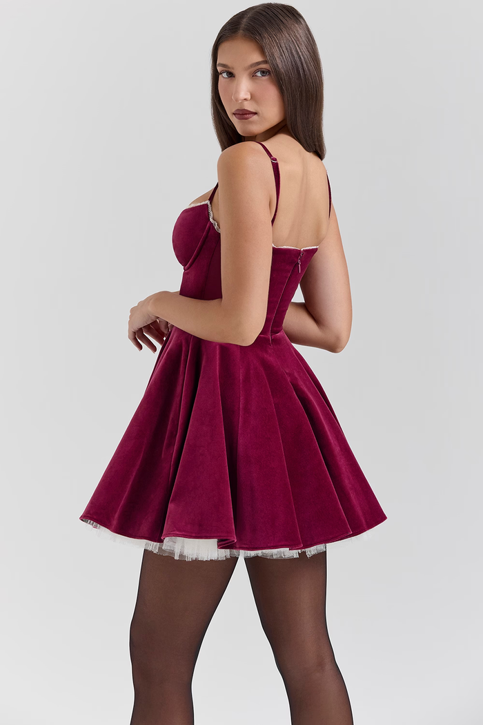 Ruby velvet mini dress with corseted bodice and tulle underskirt in burgundy