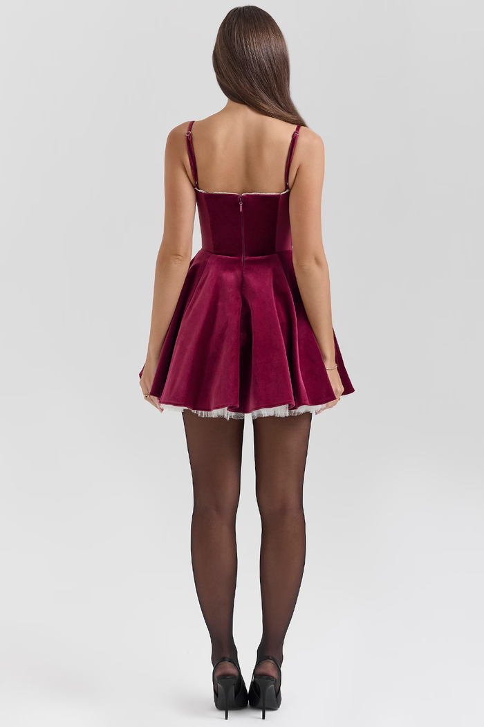 Ruby velvet mini dress with corseted bodice and tulle underskirt in burgundy