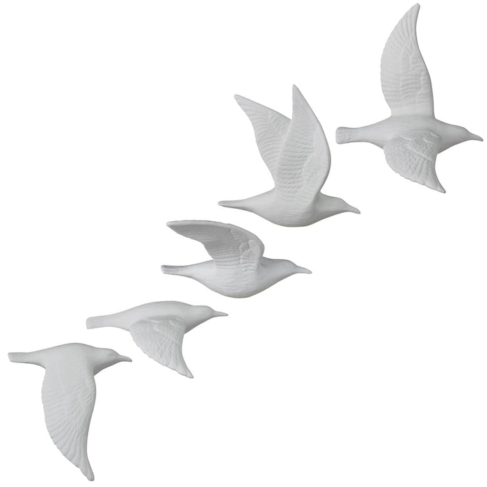Set of five white bone china flying gull figurines with raised wing details