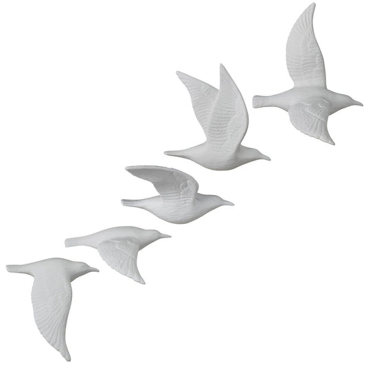 Set of five white bone china flying gull figurines with raised wing details