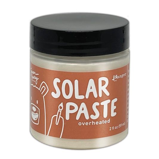 Simon Hurley  create. - Solar Paste - 2oz - Overheated. A creamy white paste with a metallic color shift when it hits the light. Color can be subtle on white cardstock but reveals an intense colored shine when applied to black. Available at Embellish Away located in Bowmanville Ontario Canada.