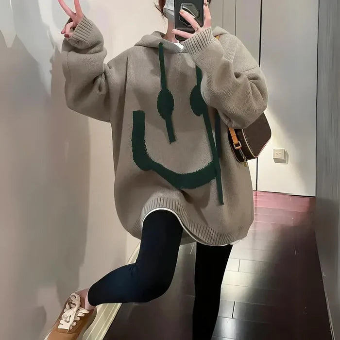 Cozy oversized hoodie with playful smiley design in khaki and black