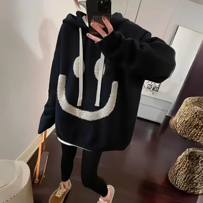 Cozy oversized hoodie with playful smiley design in khaki and black