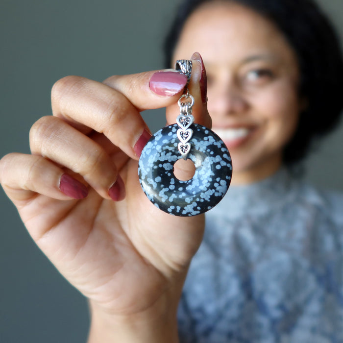 sheila holding Snowflake Obsidian Pendant