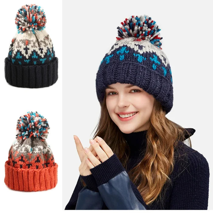 Cozy knit snowflake beanie with fluffy pom-pom shown in multiple colors