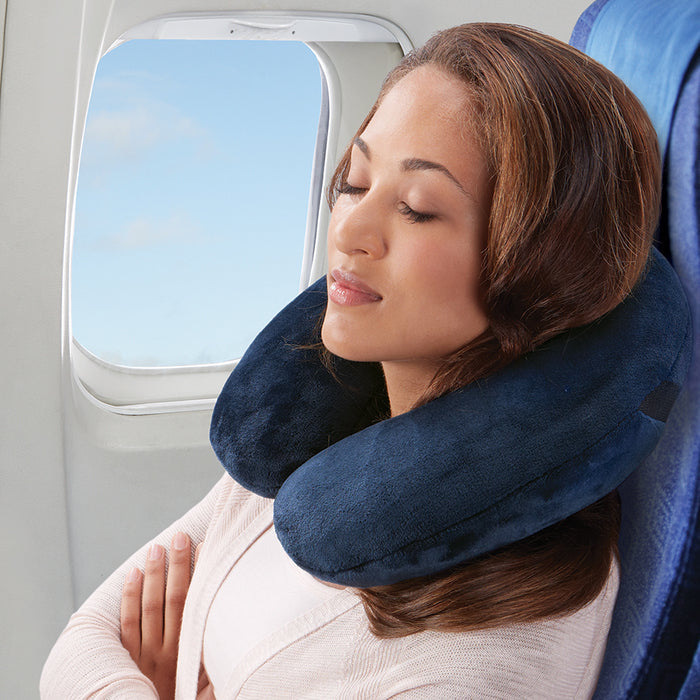 blue plush inflatable travel pillow lady on plane asleep