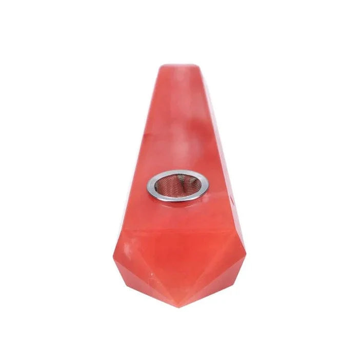 A slightly angled view of the Valiant Crystal Pipe-Red Melting Crystal, showcasing its smooth, red, crystalline form.