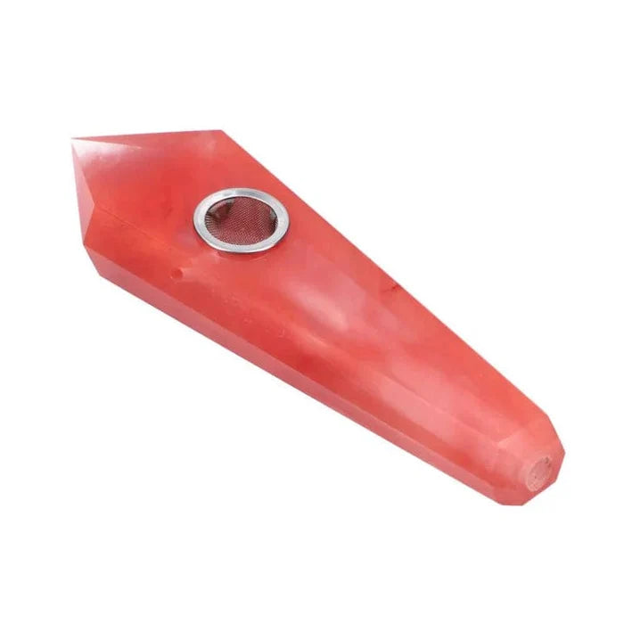 A close-up of the red, Melting Crystal Valiant Crystal Pipe, showing its smooth, sculpted form and polished finish.
