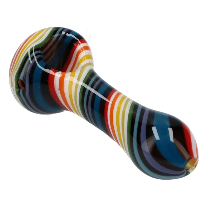 A three-quarter view of the 4-inch Valiant Spoon Pipe-Dark Rainbow, displaying its curved shape and vibrant, multi-colored glass.