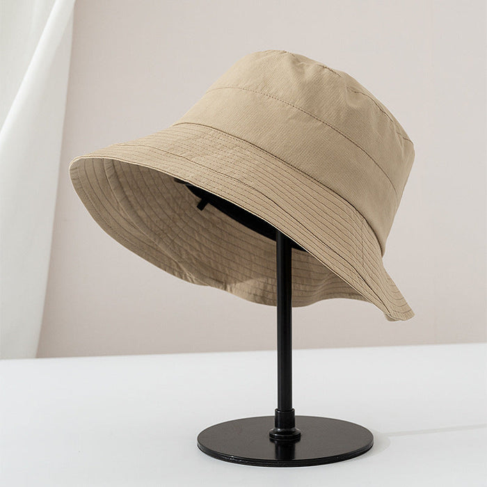 Viviane chic everyday bucket hat shown in a neutral earthy colorway