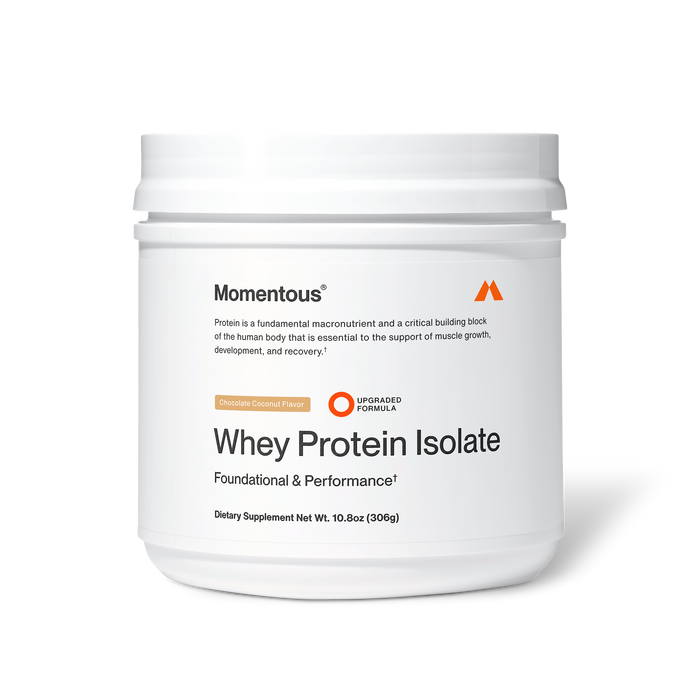 Momentous Whey Protein Isolate dietary supplement in chocolate coconut flavor, white plastic tub, 10.8 oz (306 g), labeled “Foundational & Performance” with upgraded formula badge; packaging states protein is a fundamental macronutrient and critical building block essential for supporting muscle growth, development, and recovery