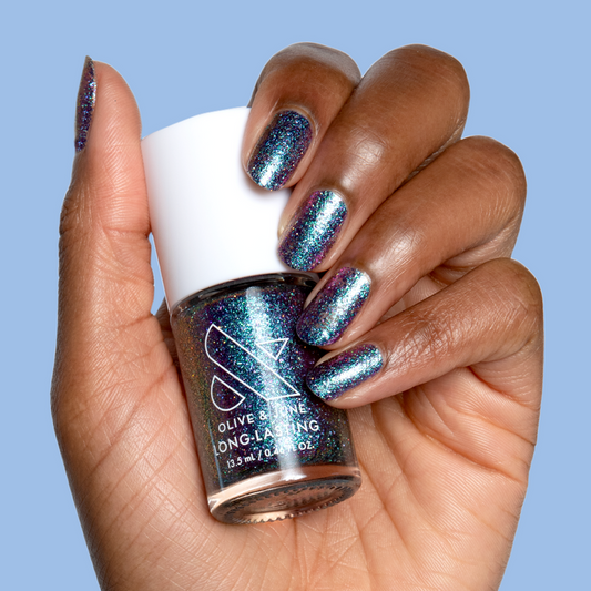 You Obviously Need It iridescent glitter polish with purple-blue shift on natural nails for a sparkling manicure